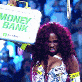 a woman holds a briefcase that says money bank on it