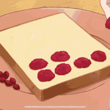 a slice of toast with red berries on it on a plate
