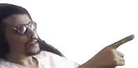 a man with glasses and a beard is pointing his finger at something .