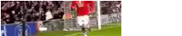 a blurry picture of a soccer player running towards a goal .