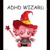 a stuffed animal with a witch hat and wand is sitting on a white background .