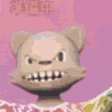 a cartoon cat with a very angry face is standing in front of a pink wall .