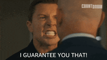 a man says " i guarantee you that " while another man looks on