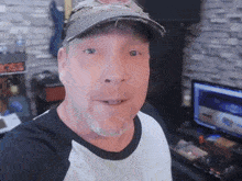 a man wearing a hat and a t-shirt with the word boss on it
