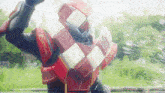 a person wearing a red and white vest with kitkat written on it
