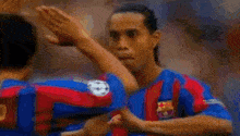 a blurry picture of a soccer player with the name gio on his back .