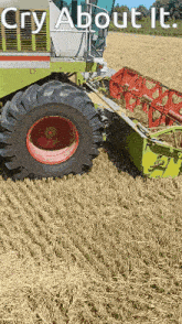 a tractor in a field with the words cry about it written above it