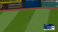 a baseball game is underway with a banner for phantom fireworks