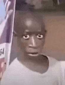 a close up of a person making a funny face with their mouth open .