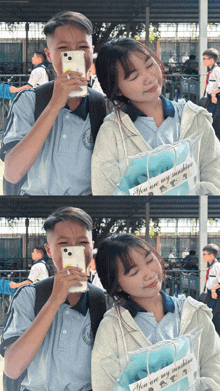 a boy and a girl are posing for a picture with a bag that says you are my sunshine
