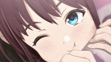 a close up of a girl with blue eyes
