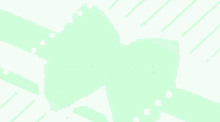 a blurry picture of a person with a green ribbon around their head .