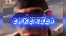 a blurry picture of a man with sunglasses and the words erkekler on the bottom