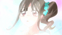 a girl with a blue ribbon in her hair looks up
