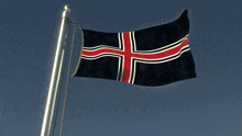 a black flag with a red cross on it is flying in the wind