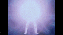 a person is standing in a dark room with a purple light coming out of their feet .