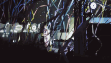 a woman stands on a stage in front of a crowd with confetti falling around her and a sign that says casa