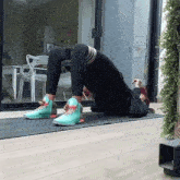 a person is doing exercises on a mat with a sign behind them that says " i love you "