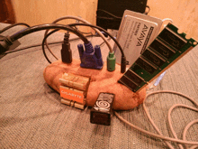 a bunch of cables are plugged into a potato with a gigabyte logo on it