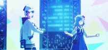 a boy and a girl are standing next to each other in front of a blue screen