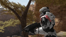 a video game character holding a gun with the number 4 on his back