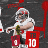 a football player kicking a ball with the word succop behind him