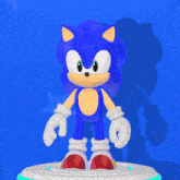 a sonic the hedgehog standing on a white podium