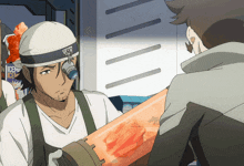 a man in a white shirt is holding a container that says nicem ice on it