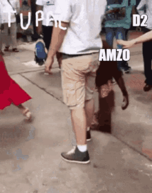 a man and a monkey are walking down a sidewalk and the monkey says amzo