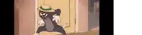 tom and jerry are standing in front of a door wearing hats and gloves .