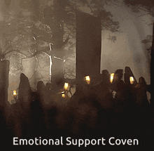 a poster for emotional support coven shows a group of people holding candles in a dark forest