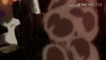 a close up of a person holding a sword in front of a skull .