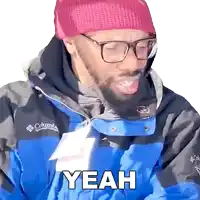 a man wearing a blue jacket and a pink hat says yeah