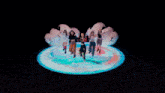 a group of girls are dancing on a stage with a circle in the middle and the number 6 on it