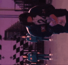a group of people are standing next to each other on a purple background .