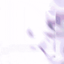 a blurry picture of a person 's face with a purple background