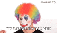 a man is wearing a clown wig and makeup and says `` it 's me believing her ''