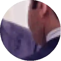 a blurry picture of a person 's face in a purple circle
