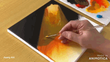 a person is painting on a canvas with the words made in animotica on the bottom