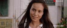 a close up of a woman 's face with the words terbak ke langit on the bottom right