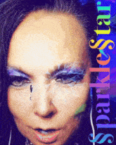 a close up of a woman 's face with the words sparklestar written on the bottom