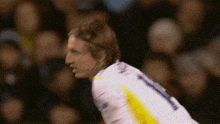 a soccer player wearing a white jersey with the number 1 on it