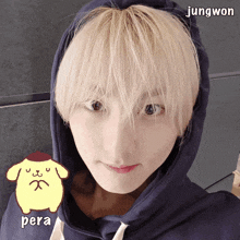 a young man wearing a blue hoodie with the name jungwon written on the bottom right corner