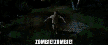 a group of people are standing in a dark room with the words `` zombie ! zombie ! ''
