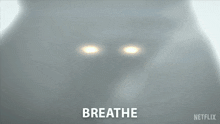 a close up of a person 's face with the words breathe written on it