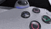 a close up of a video game controller showing the buttons x o and a