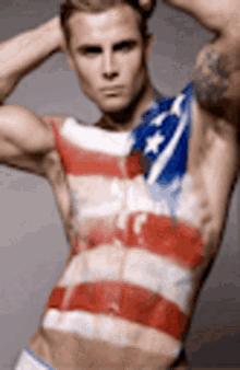 a shirtless man with an american flag painted on his body