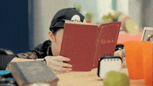 a person is reading a book called fool 's diary