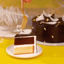 a slice of cake on a white plate with a fork