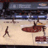 a basketball game is being played in a stadium with a sign that says chicago on it